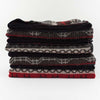 Stack of Johnson Woolen Mills wool blanket in grey and red with holiday reindeer print on a white background