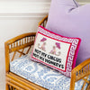 Wicker chair with pillow Needlepoint pillow with Not My Circus Not My Monkeys saying