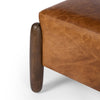 Square leather 'Oaklynn' ottoman by four hands furniture with oversized round wood legs  on a white background