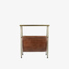 Rectangular brass side table with magazine rack leather storage below on a white background