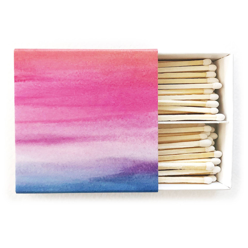 Match box with ombre pink and blues on a white background