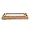 Two rectangular trays with woven seagrass and cotton surface stacked and seen from above on a white background