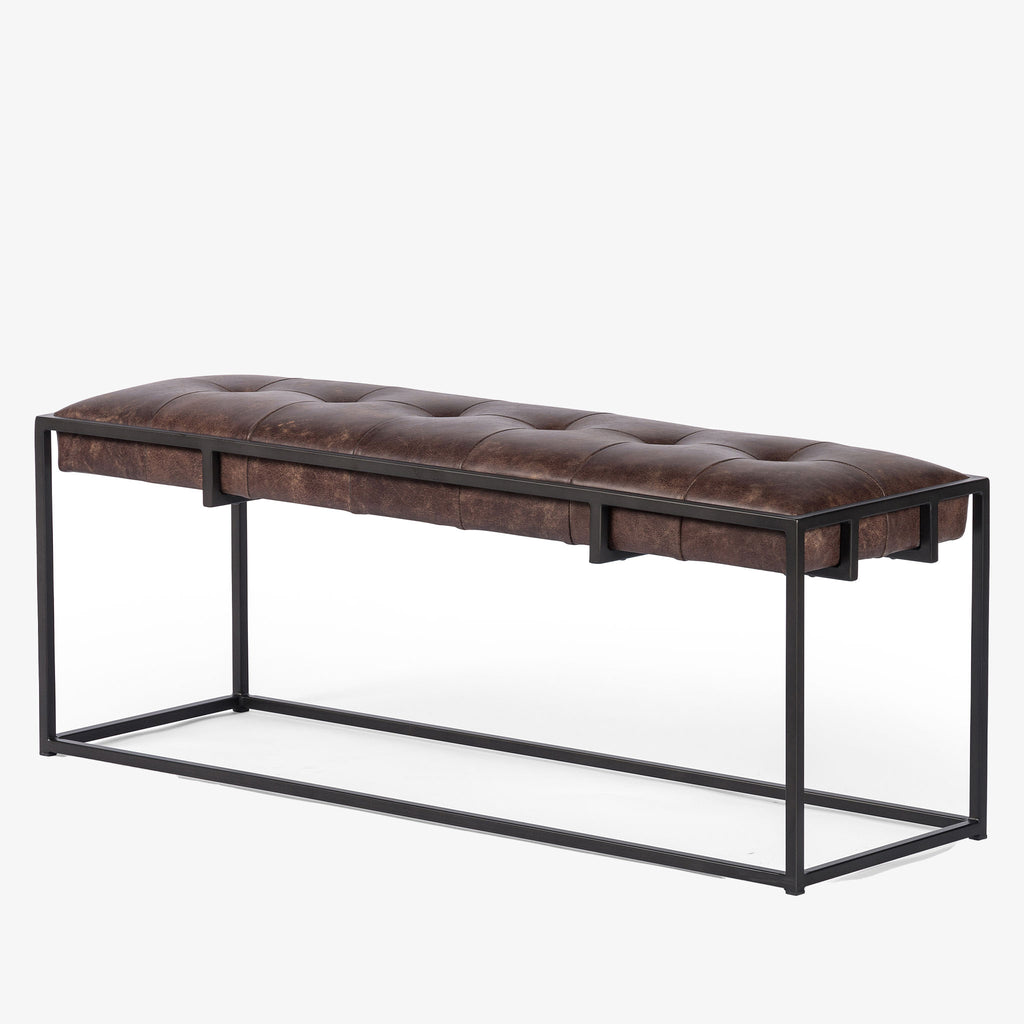 Four hands brand Oxford bench with iron frame and brown leather top on a white background