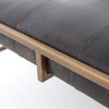 Four hands brand Oxford square coffee table with brass frame and black leather top on a white background