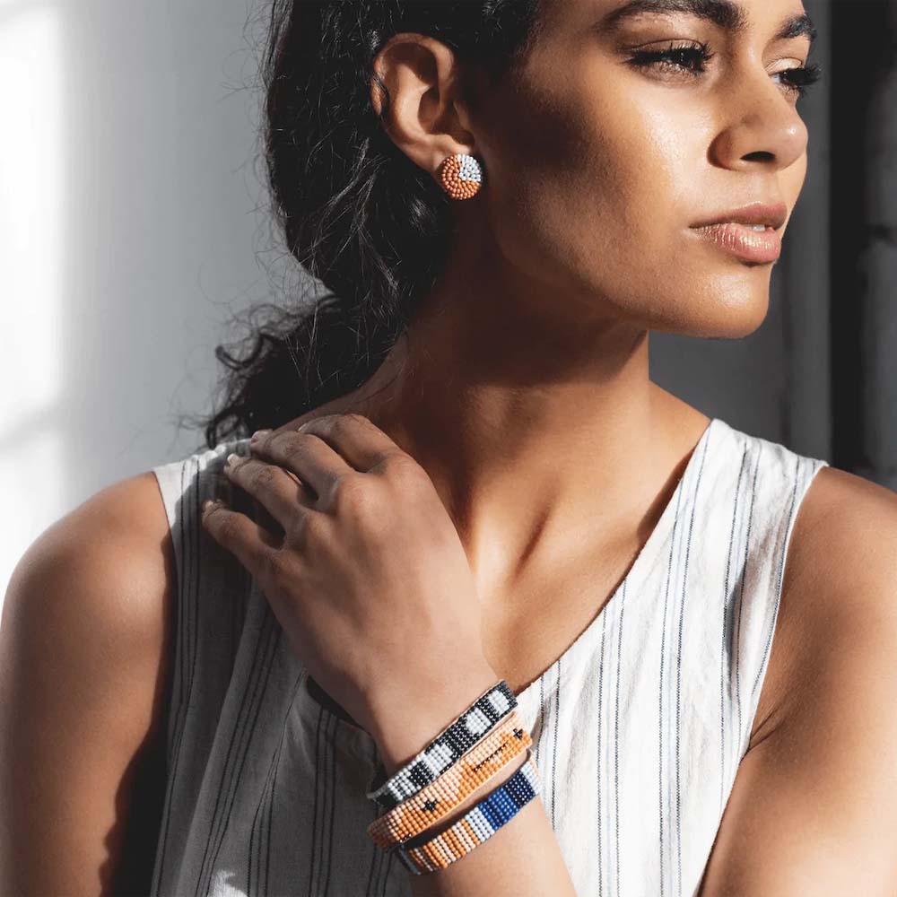 Ink + Alloy Lapis Stripe bracelet on model wearing stack of beaded bracelets