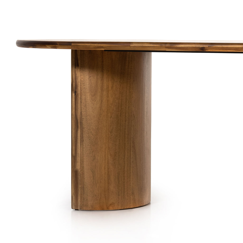 Close up of wood base on Light wood 'Paden' oval dining table by Four Hands Furniture with two legs to support thick top on a white background