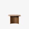 View from end of Four hands brand oval wood 'Paden' coffee table on a white background