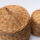 Close up of line feature on natural wicker basket with lid on a white background 