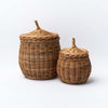 Set of two Natural wicker basket with lid on a white background