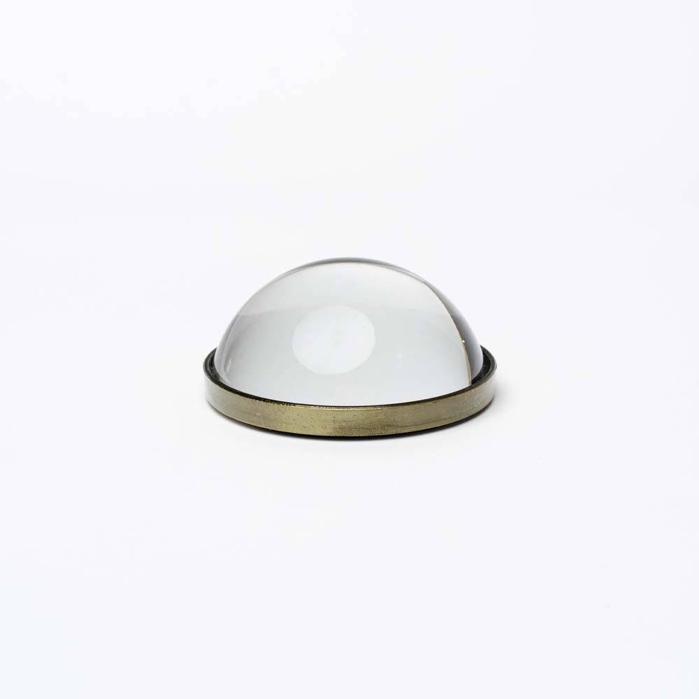 Glass and metal Paperweight Magnifying Glass on a white background