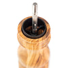 Close up of interior of Peugeot Paris brand olive wood pepper mill on a white background