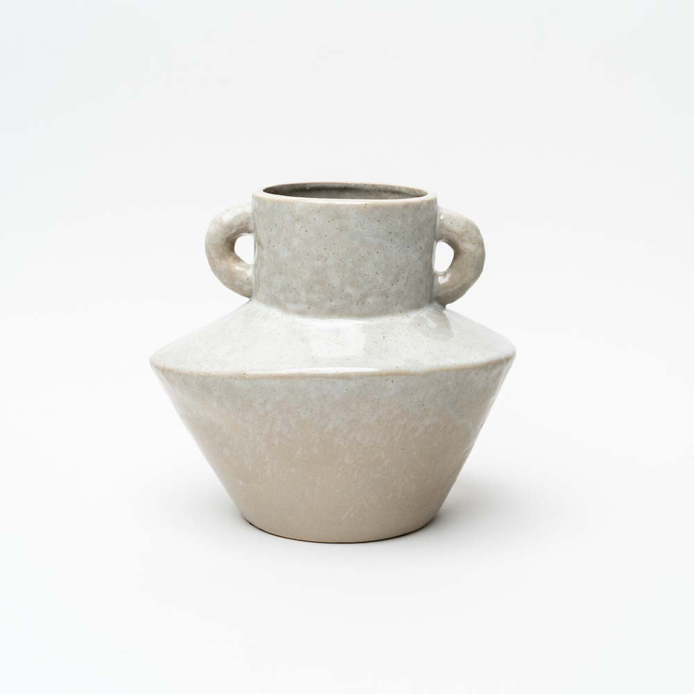 Reactive glaze white stoneware vase with handles on both sides on a white background