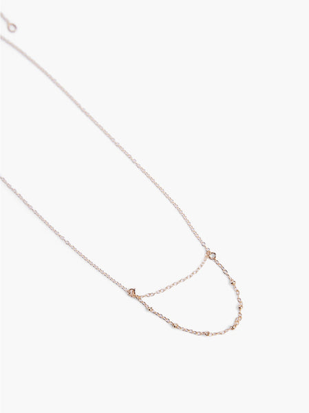 Able jewelry brand petite layered necklace on a white background