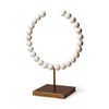 White Beaded Broken Sphere Decorative Object with Gold Base on a white background front view