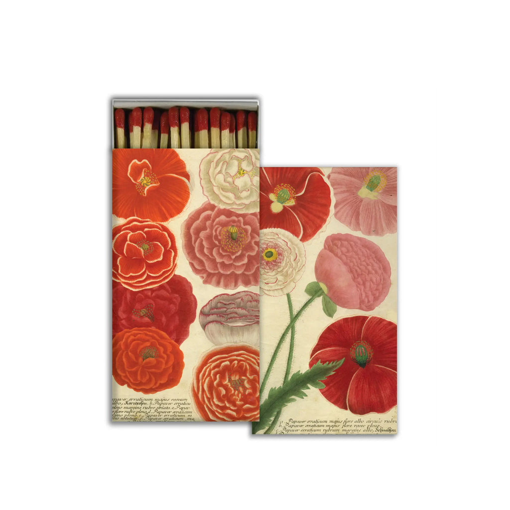 Box of matches with red tips and poppies on the box on a white background