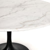 Four hands brand Powell dining table with black tulip base and white marble top