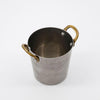 Nicolas Vahé brand metal presentation pot with brass handles on a white background