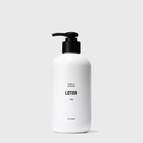 Public goods brand hand lotion in a white bottle with black pump top on a white background