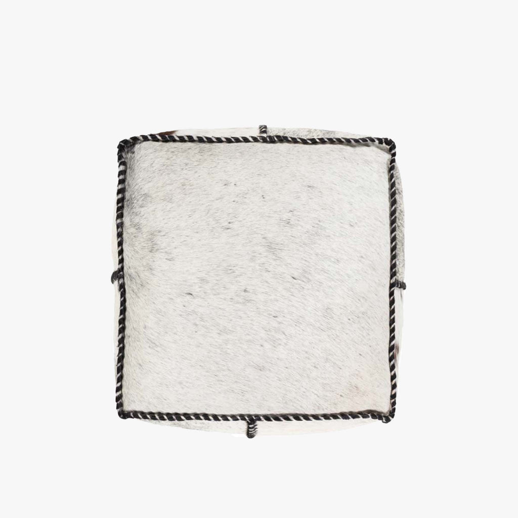 Top view of white and black cow hide ottoman