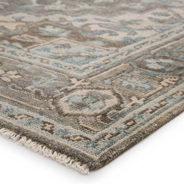 Side view of Jaipur living Salinas rug with center medallion and pop of sky blue