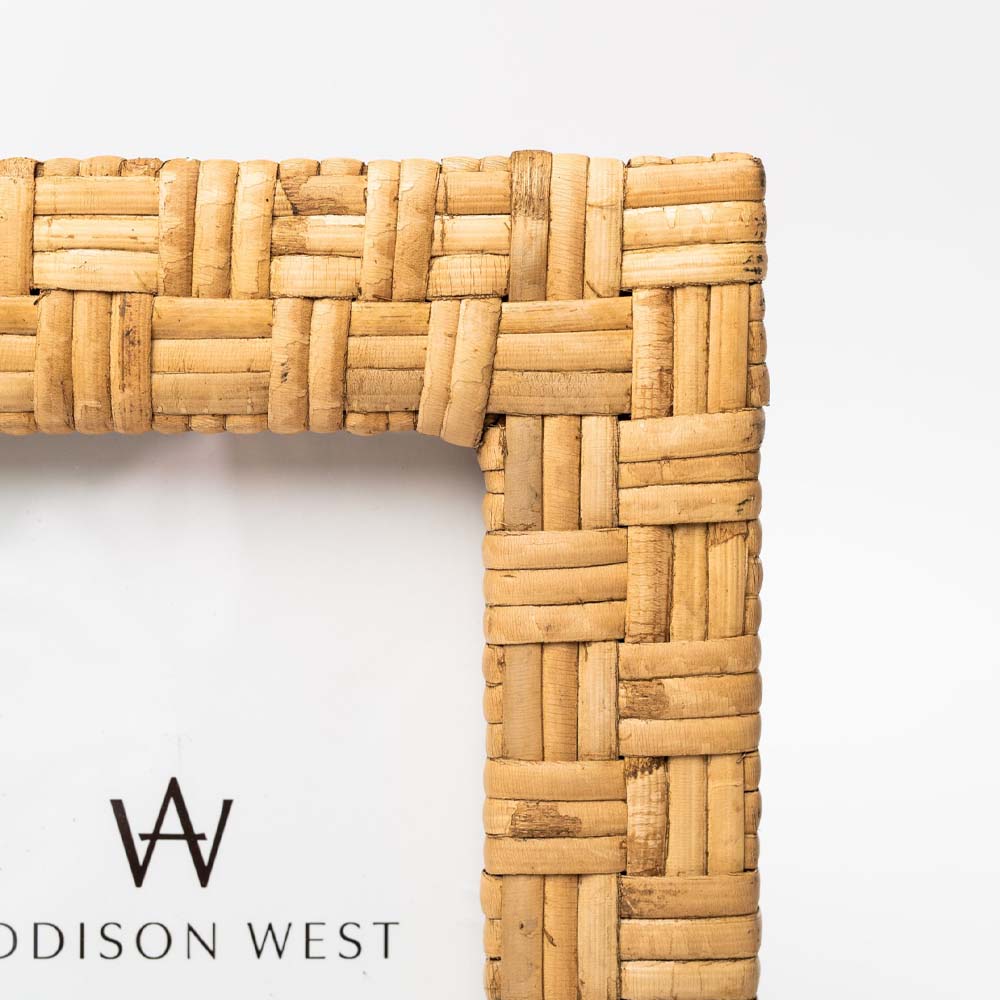 Close up of Rattan picture frame on a white background