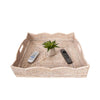 Square whitewashed rattan tray with scallop edge and two handles on a white background with remotes and vase