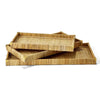 Set of three rattan rectangular trays with brass corners on a white background 
