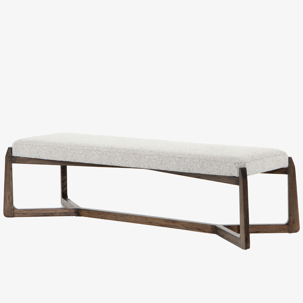 White upholstered 'Roscoe' bench with cross brace wood frame  by four hands furniture on a white background