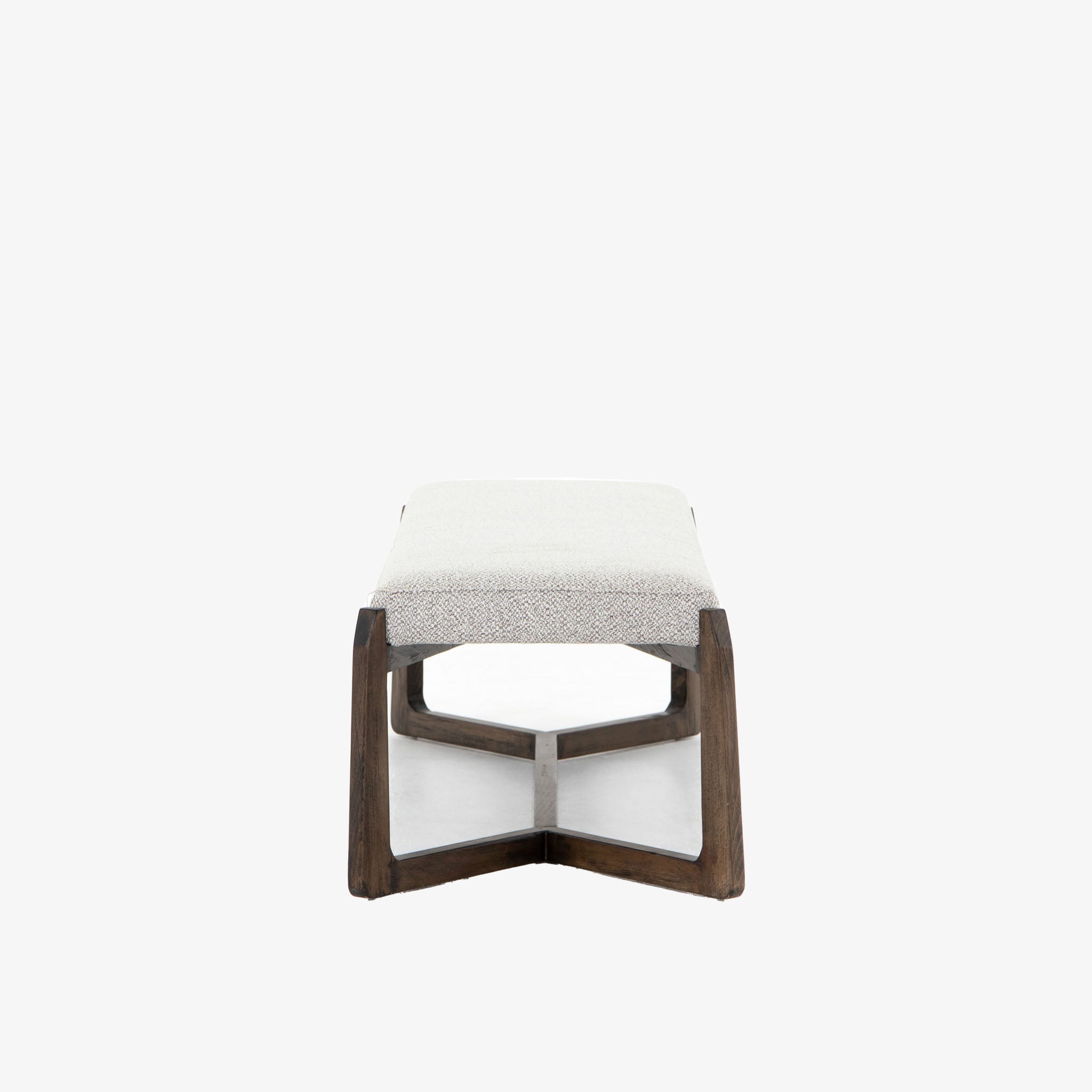 White upholstered 'Roscoe' bench with cross brace wood frame  by four hands furniture on a white background