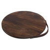 Round walnut JK Adams cutting board with leather handle on a white background
