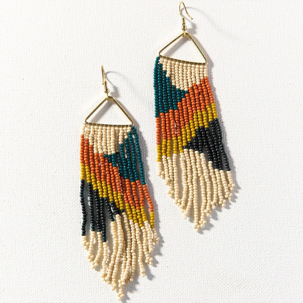 Ink + Alloy brand peacock earring in rust citron on a white background