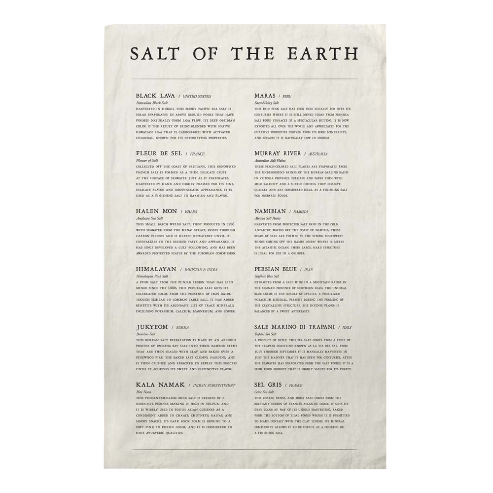 Pure cotton hand-screened salt of the earth tea towel on a white background