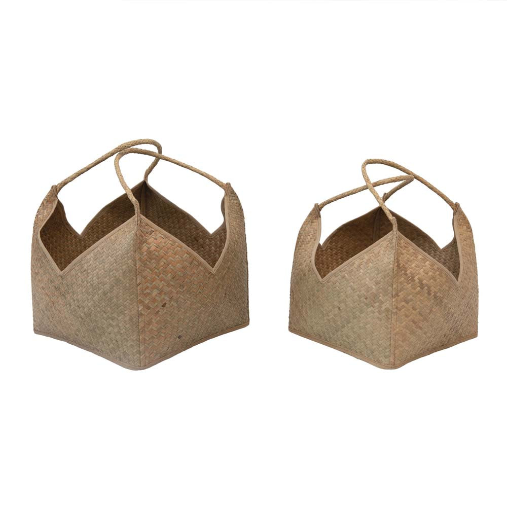 Two large square seagrass baskets with handles on a white background