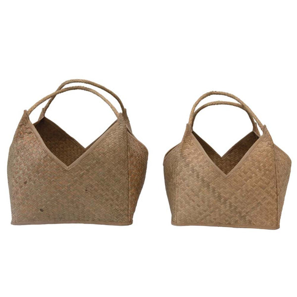 Two large square seagrass baskets with handles on a white background