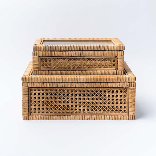 Creative coop cane and rattan boxes on a white background