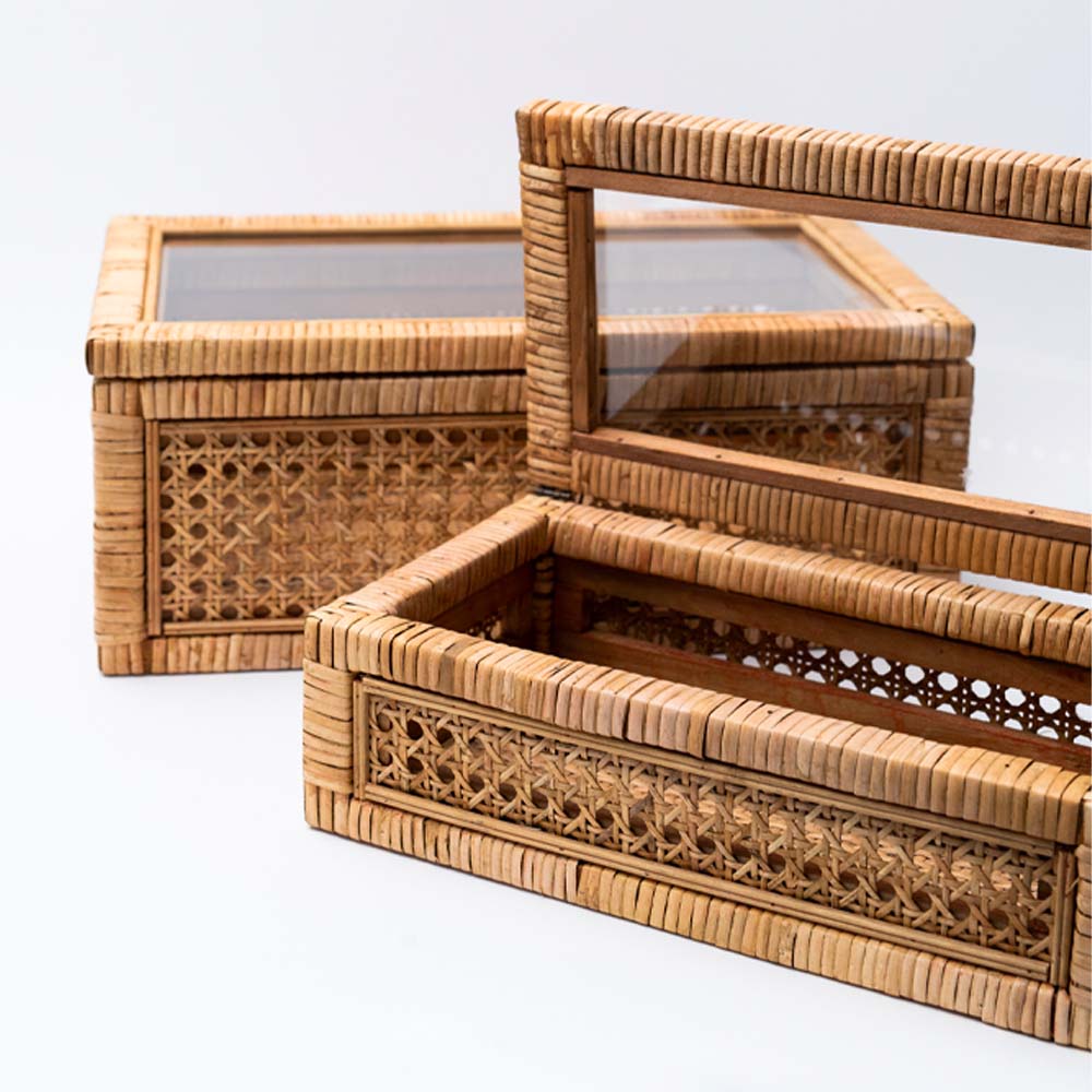 Close up of cane and rattan boxes on a white background