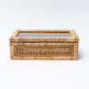 Small cane and rattan boxes with glass lid on a white background