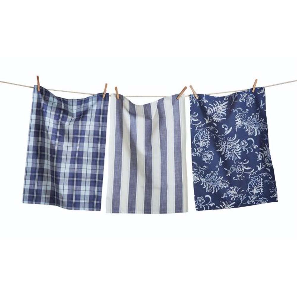 Set of three Blue Kitchen Towels in check and stripe and botanical print on a clothes line in front of a white background