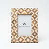Brown wood and ivory resin geometric patterned 4x 6 picture frame on a white background