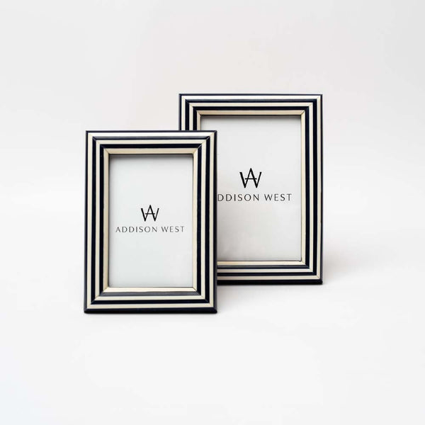 Set of two blue and white stripe picture frames on a white background