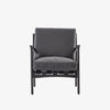 Four hands brand Silas arm chair with black wood frame and black leather cushions on a white background