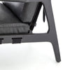 Four hands brand Silas arm chair with black wood frame and black leather cushions on a white background