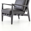 Four hands brand Silas arm chair with black wood frame and black leather cushions on a white background