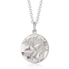 Scream Pretty brand silver Aquarius zodiac star sign necklaces on a white background