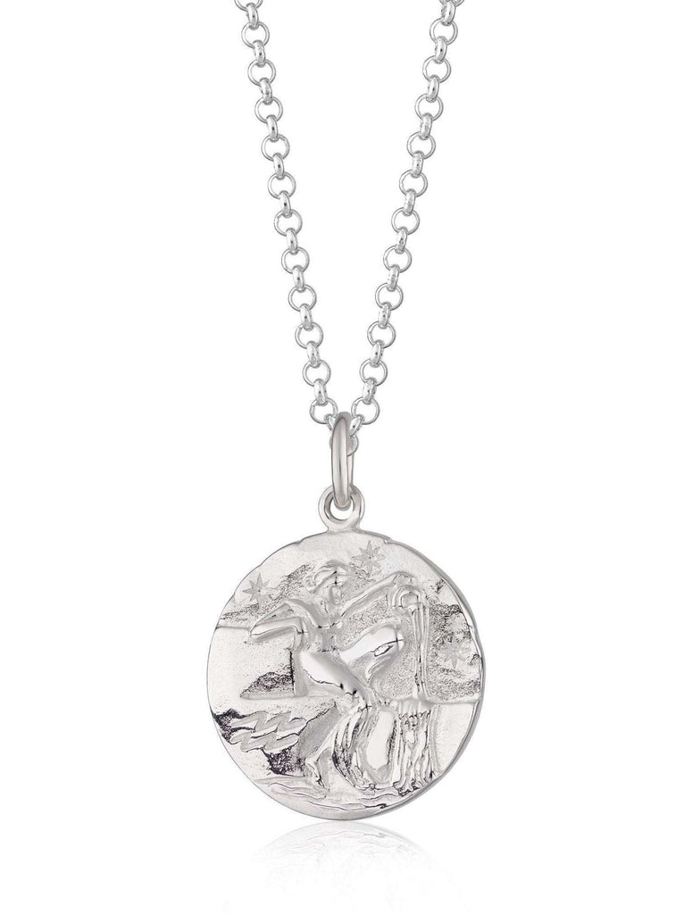 Scream Pretty brand silver Aquarius zodiac star sign necklaces on a white background