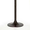 Antique rust colored 'Simone' metal bar height tulip table by four hands furniture on a white background