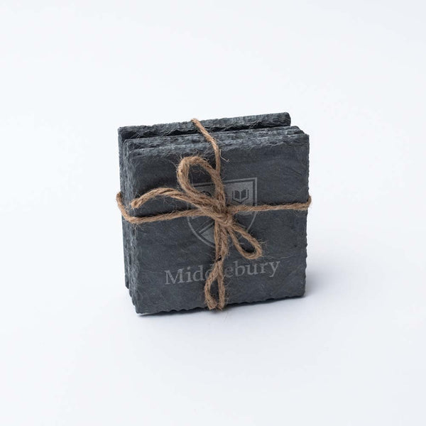 Set of four square slate Middlebury College coasters tied together with natural twine on a white background 