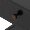Close up of pull on black single drawer 'Soto' end table by four hands furniture on a white background