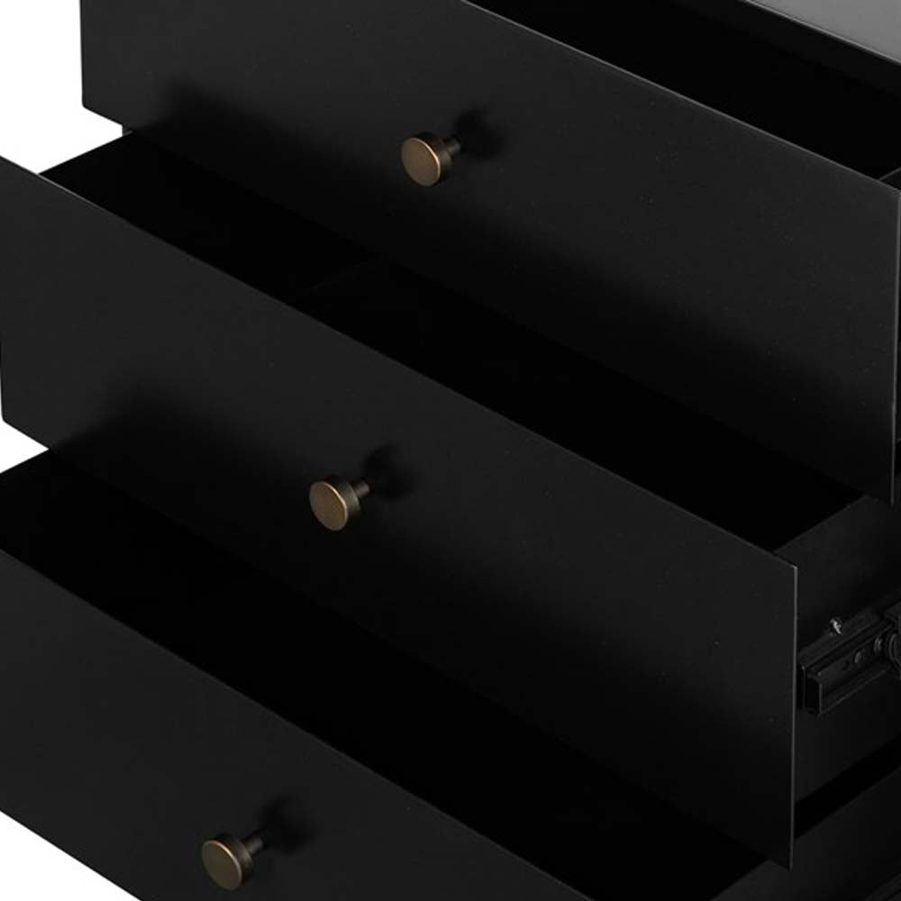Close up of drawers on Black three drawer 'Soto' nightstand by four hands furniture