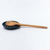 Indigo Handmade stoneware spoon rest on a white background
